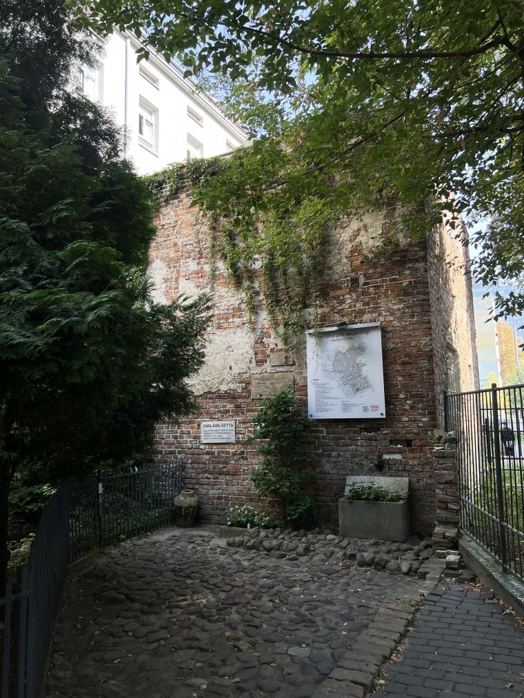 Fragment of the Warsaw Ghetto wall with a historical map of the area