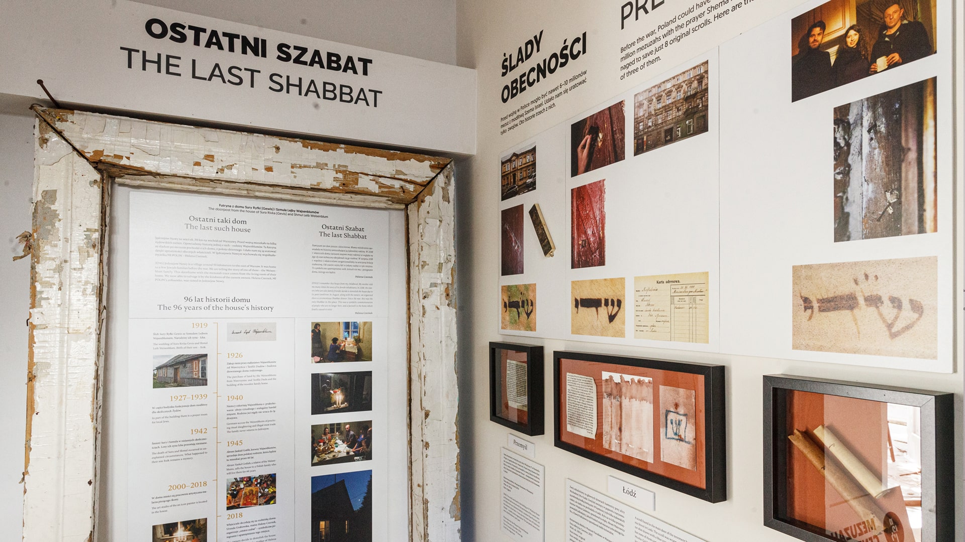 Mezuzah museum exhibit on “The Last Shabbat” featuring historical information, photos, and traces of mezuzahs