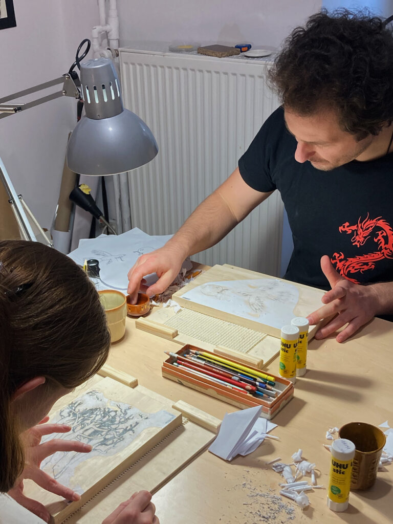 Two people working at a table during the Japanese Woodblock Printing workshop led by Helena Czernek