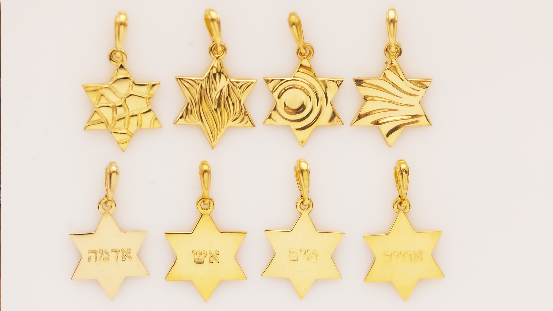 Silver Star of David pendants with engraved patterns and Hebrew words, inspired by water, fire, air, and earth mezuzah trace, designed by MI POLIN design