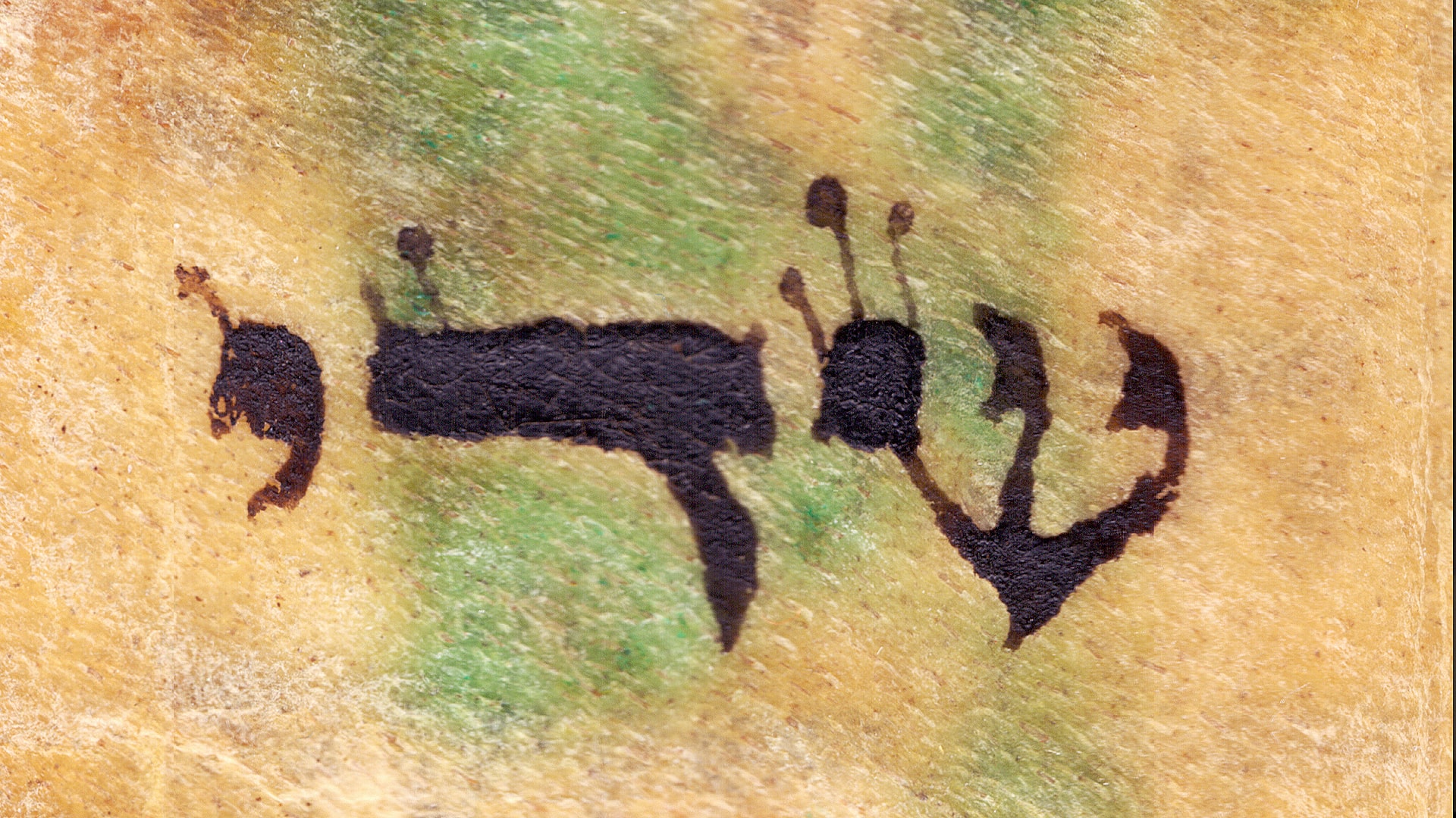 Close-up of Hebrew word שדי “Shaddai” hand-written on parchment, traditional mezuzah trace inscription